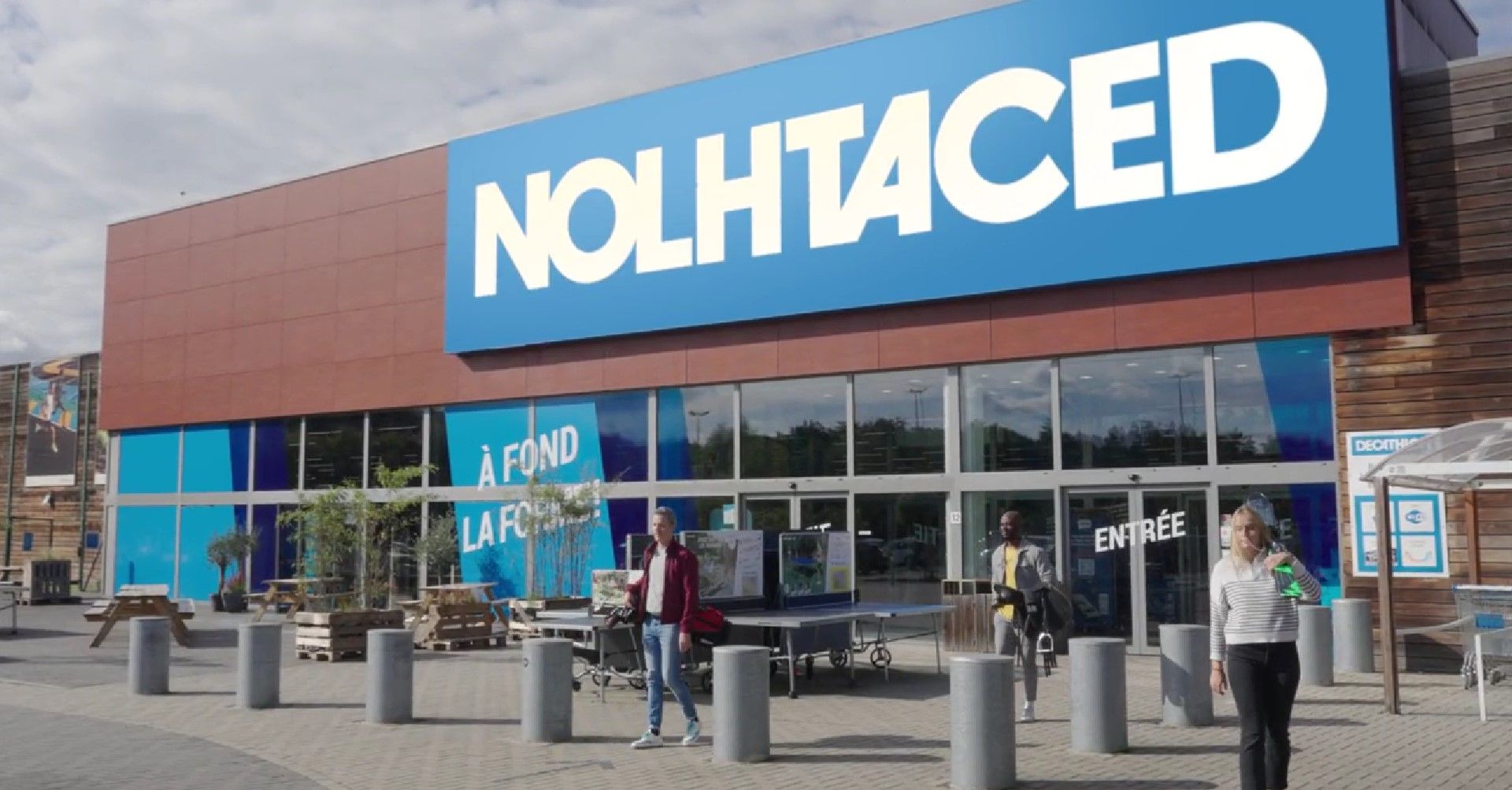 Why has Decathlon reversed its name to Nolhtaced in Belgium?
