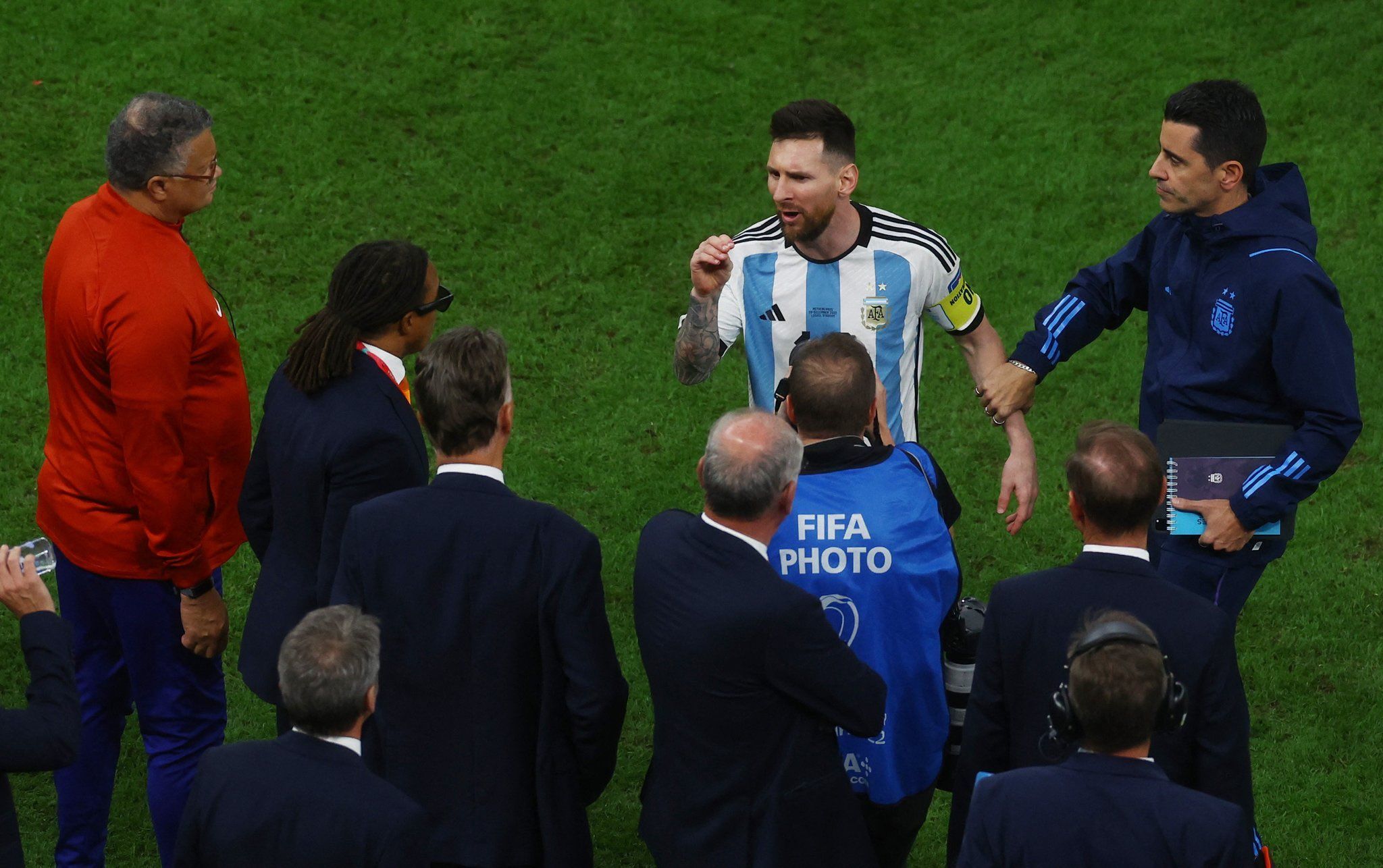 Angry Lionel Messi tells the Netherlands coach Louis van Gaal he talks too much after quarterfinal victory