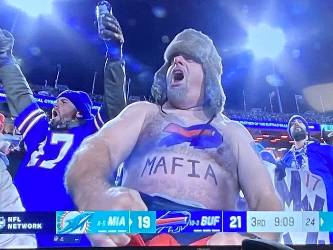 Pictures of shirtless Buffalo Bills fan in snowy Highmark vs Miami, one with Bills Mafia on belly, go viral