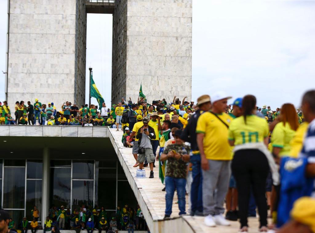 Jair Bolsonaro’s supporters beat horse-mounted police with sticks inside Brazils presidential palace: watch