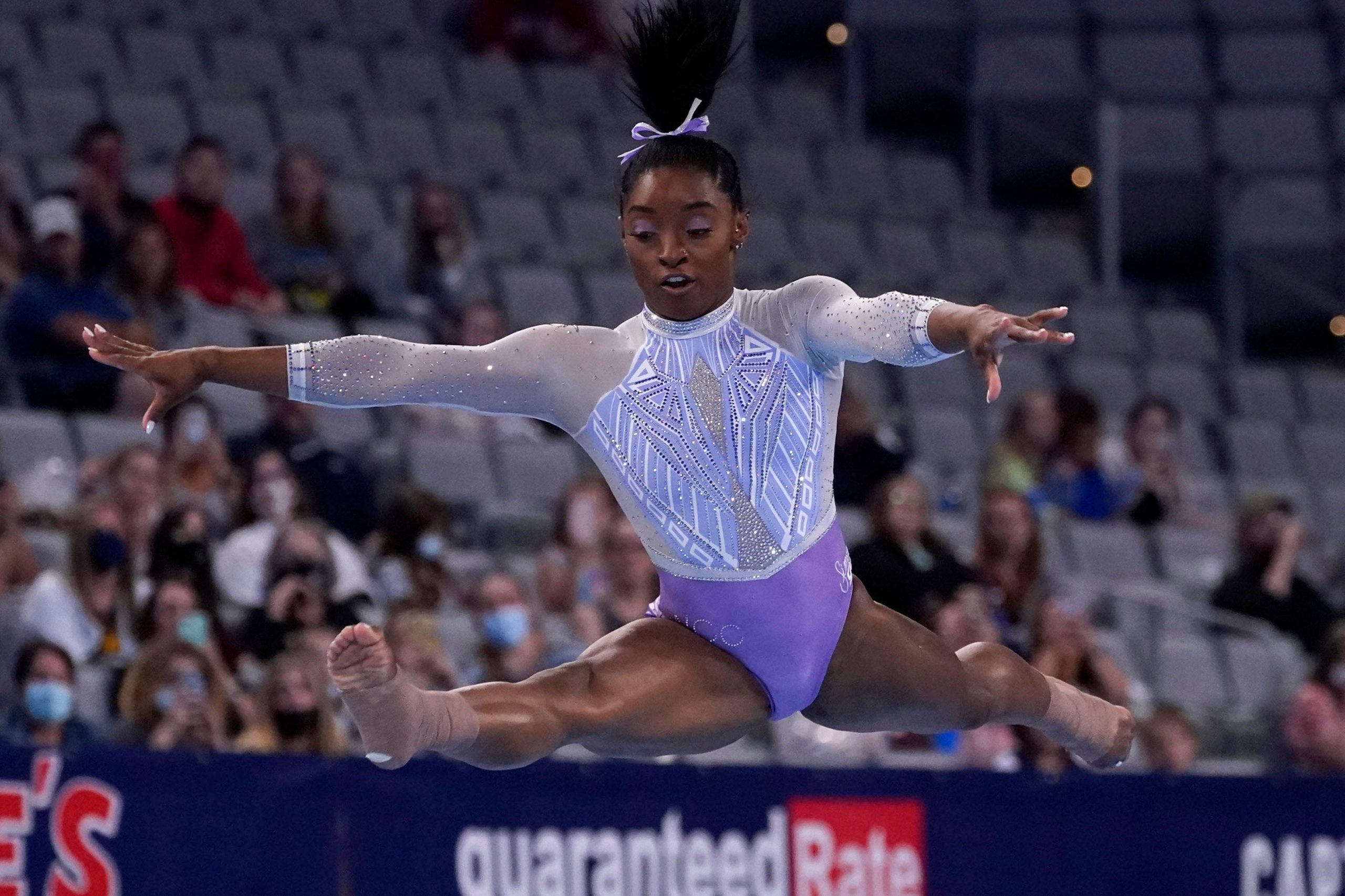 Biles launches history bid as surfing, skateboarding make Olympic debut