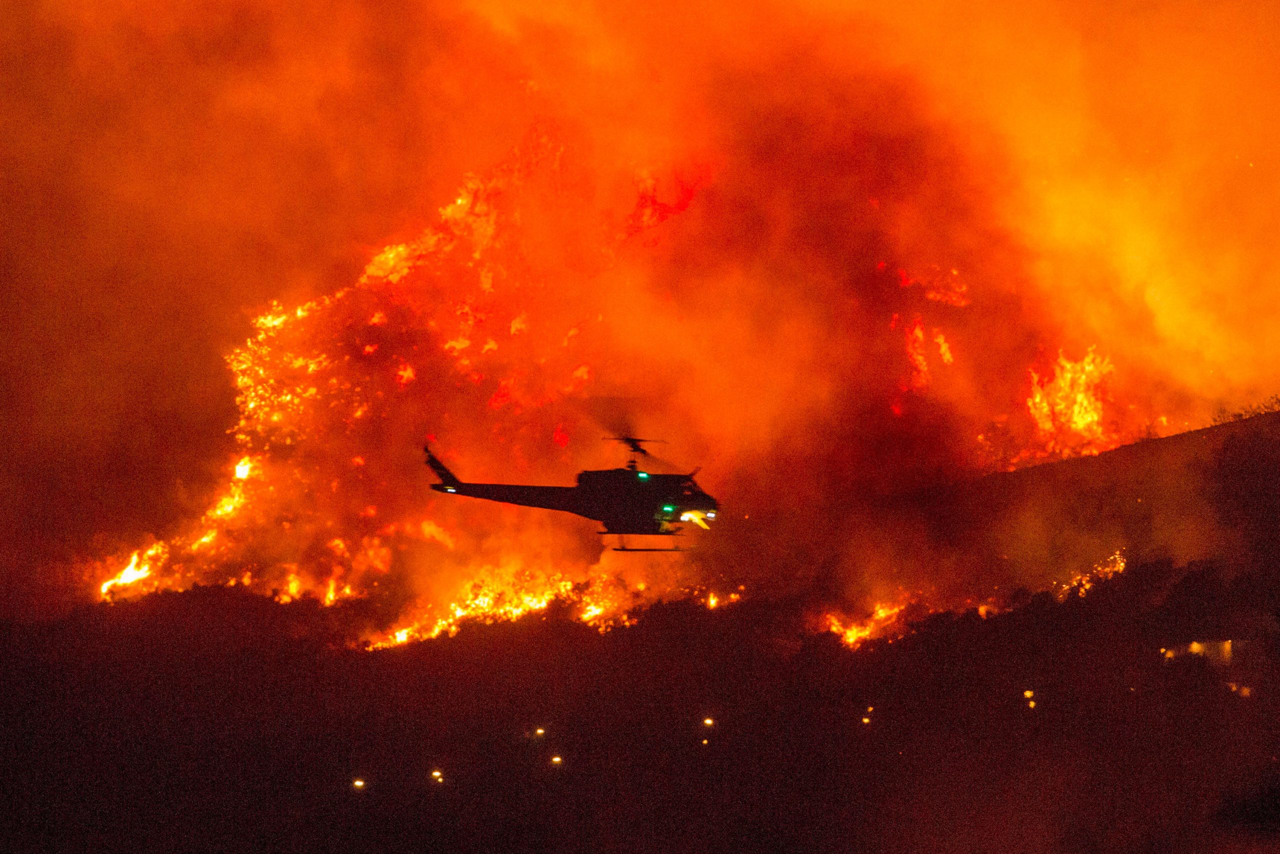 California fire burns 2 million acres, smoke hampers rescue operation