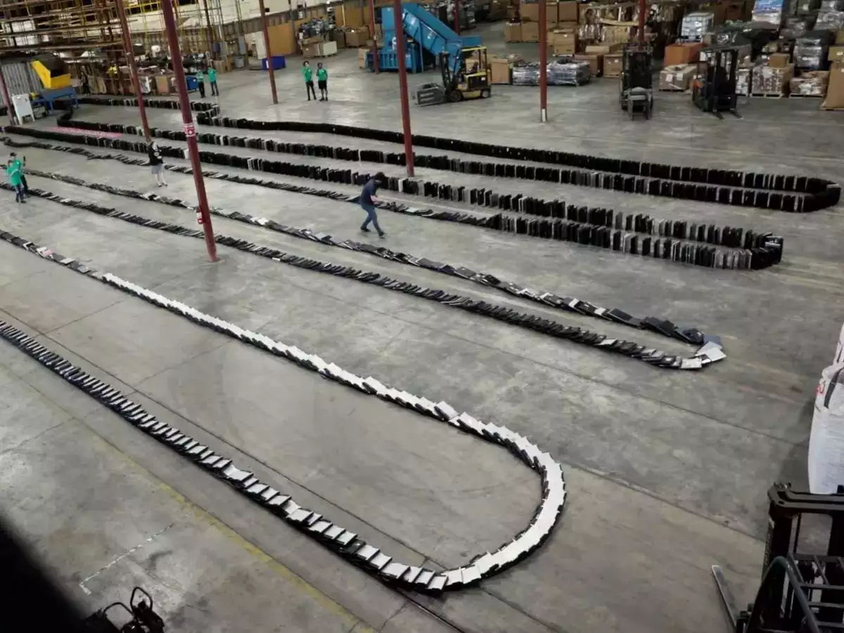 Recycling company beats world record by toppling 2,910 laptops