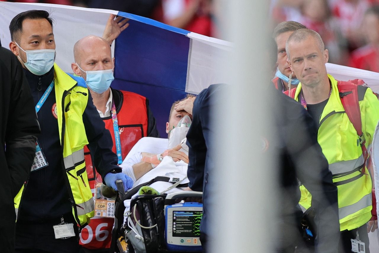 Christian Eriksen ‘awake’ and in hospital after collapse in Euro 2020 game