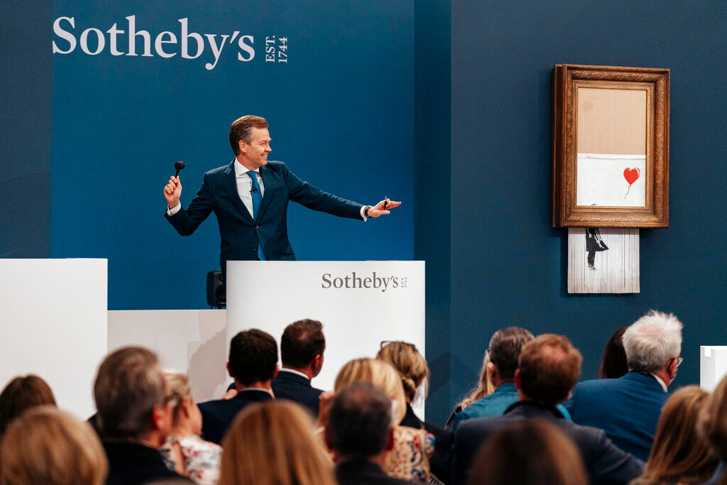 Banksy’s shredded artwork ‘Love is in the Bin’ fetches $25.4 million in auction