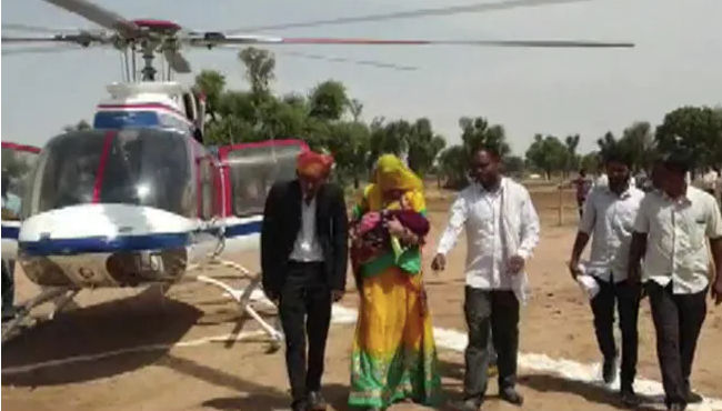 Rajasthan man brings home his newborn daughter in a helicopter