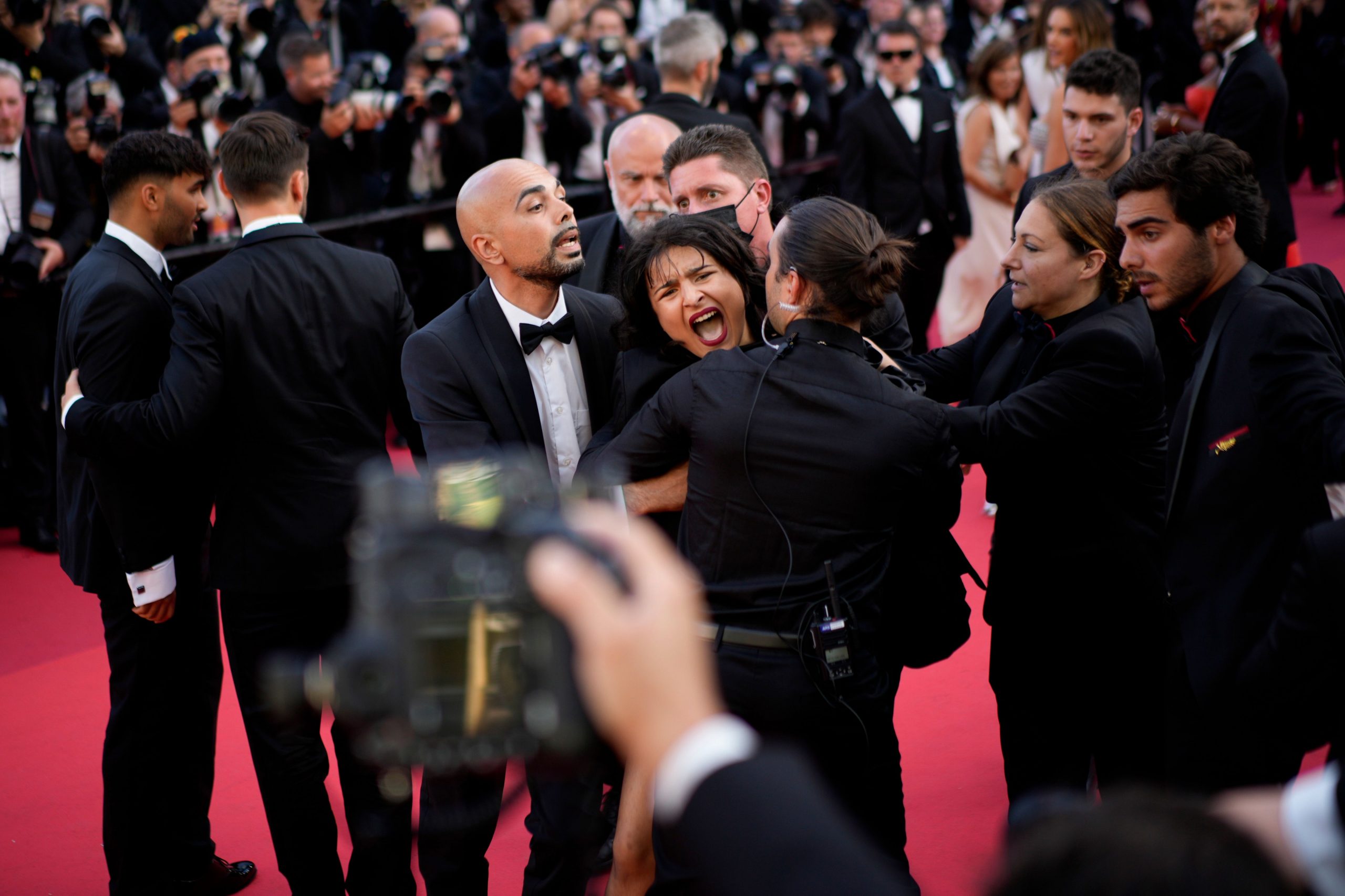 ‘Stop raping us’: Topless Ukrainian protestor removed from Cannes