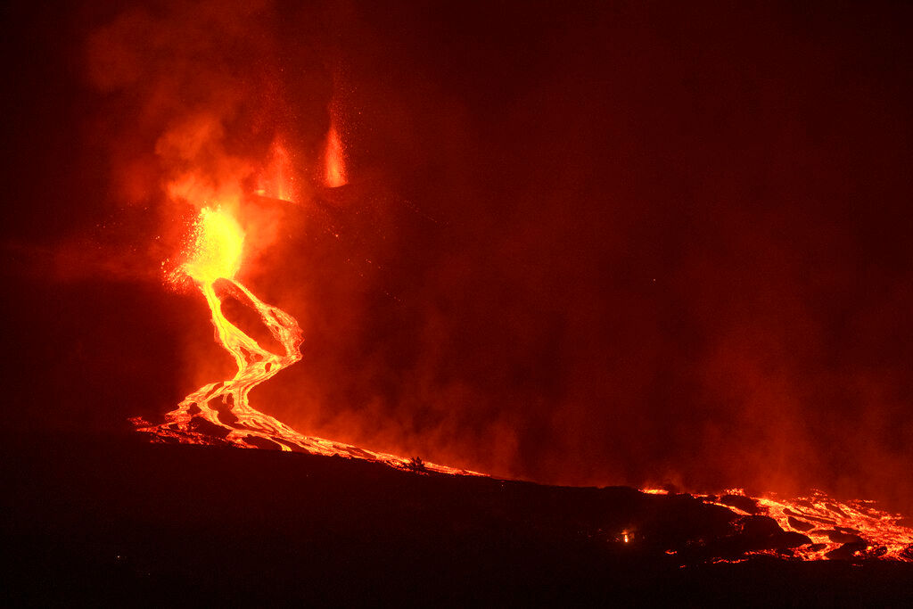 Lava flowing from erupting volcano in Spanish island rages toward sea