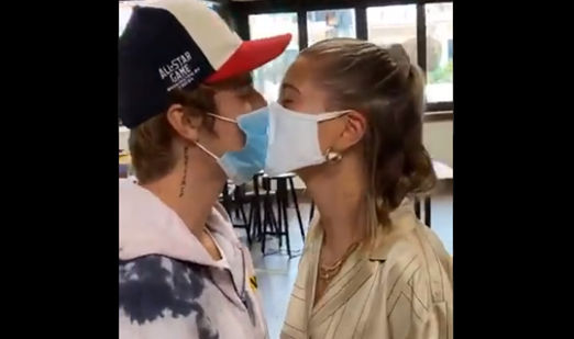 Masked kiss is the latest PDA trend, health experts say ‘watch out’