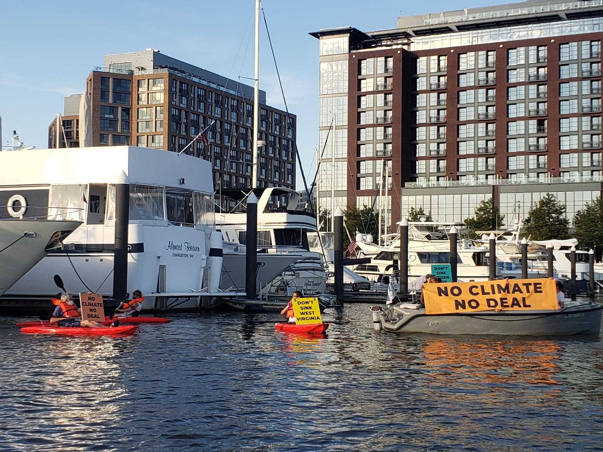 Activists protest Democrat senator’s opposition to Build Back Better, in boats