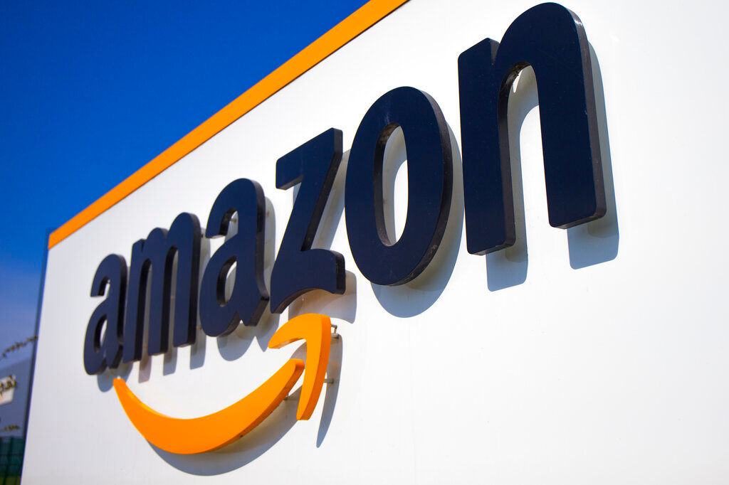 Amazon reports plunging sales, profit as COVID curbs begin to ease