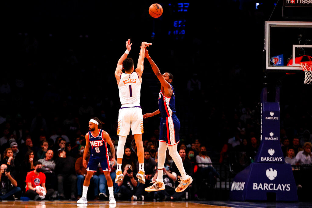 NBA: Suns extend win streak to 16 with 113-107 victory over Nets
