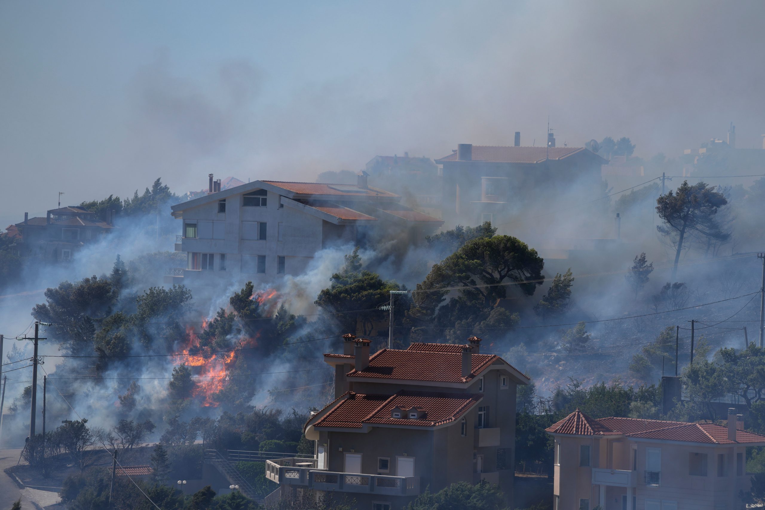 Wildfires threaten Athens’ hillside suburbs for second day