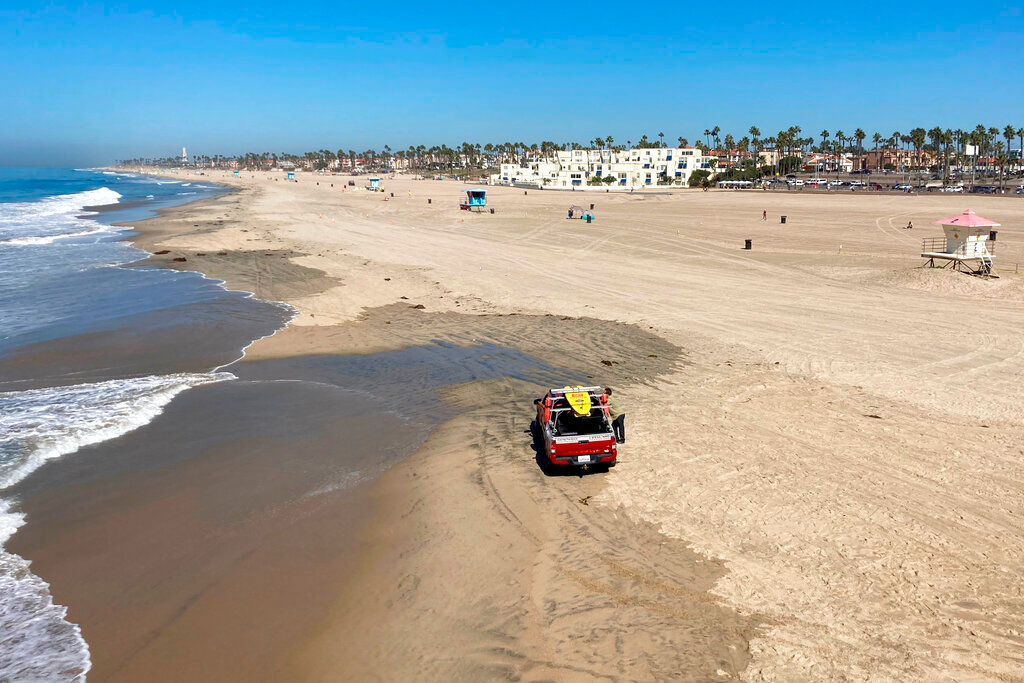 ‘Surf City USA’ beach in California opens for the first time after the oil spill