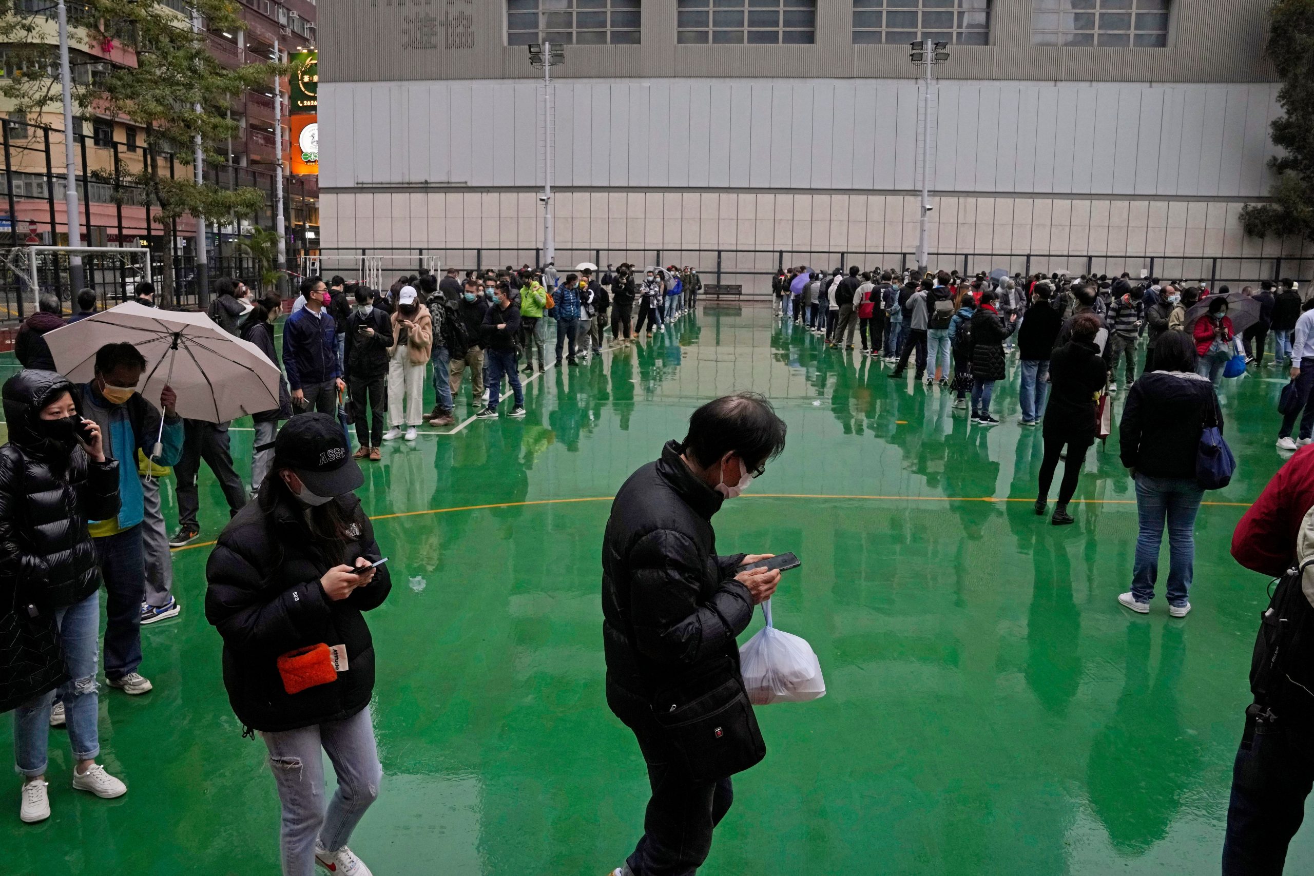 As COVID soars, Chinese city locks down, Shanghai closes schools