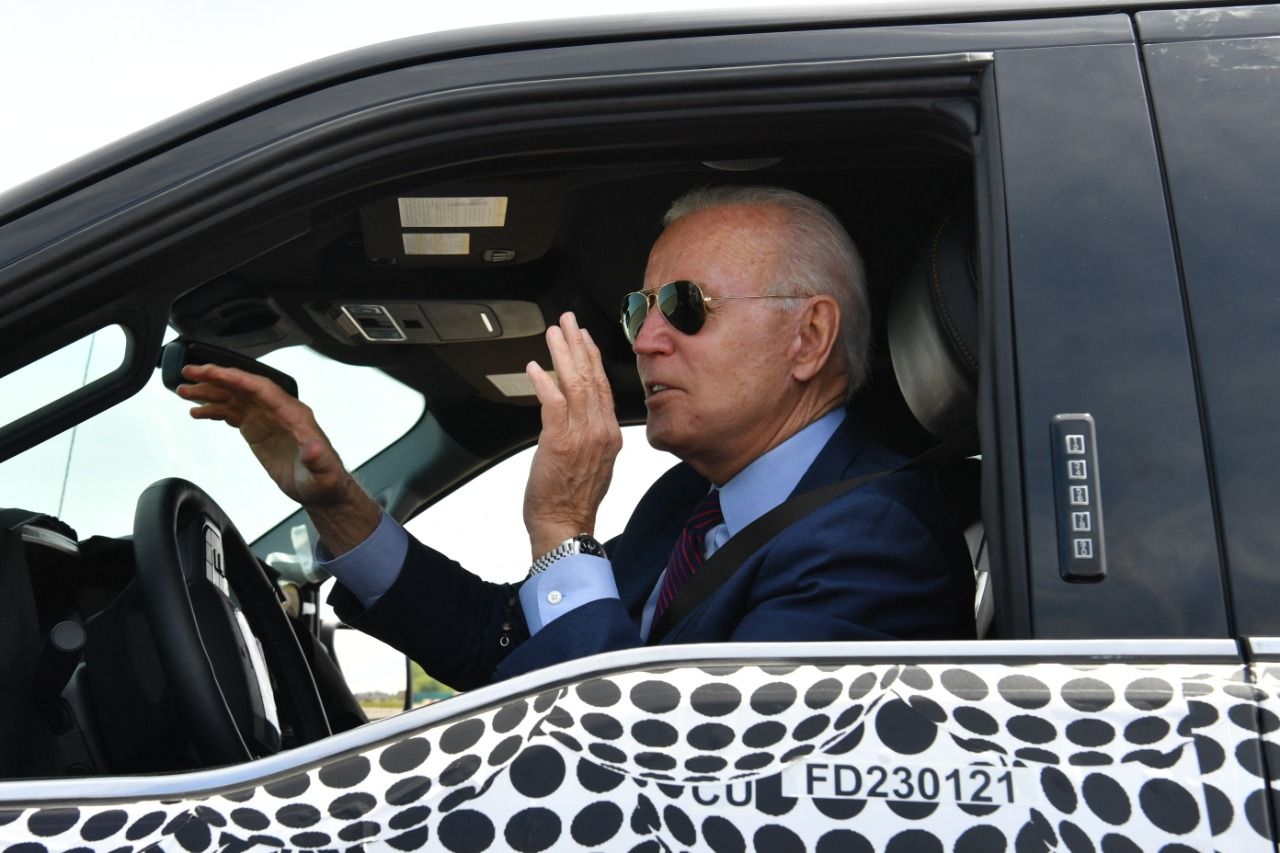 Fast car, aviators and wit: Biden’s unplanned visit to automobile facility