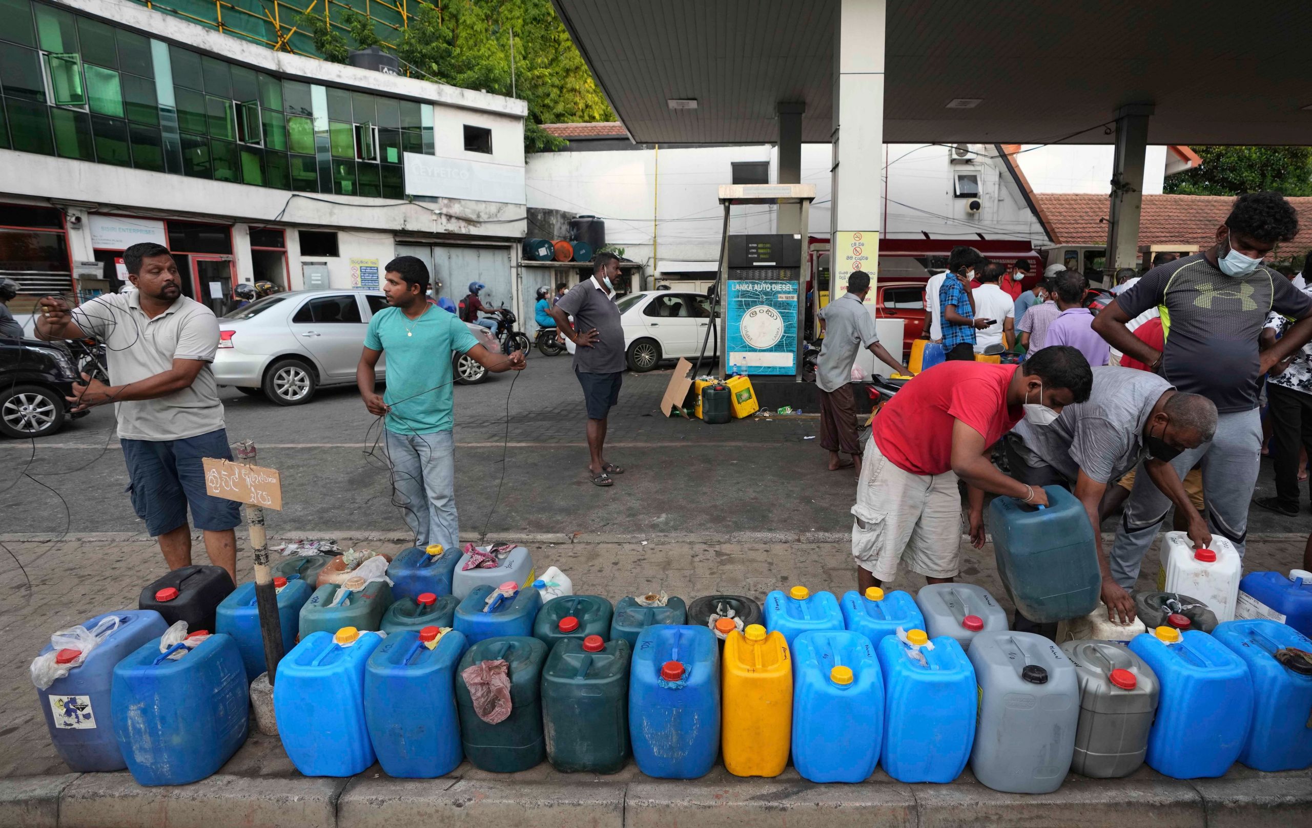 With no promise on fuel refill, Sri Lankans queue at pumps for days