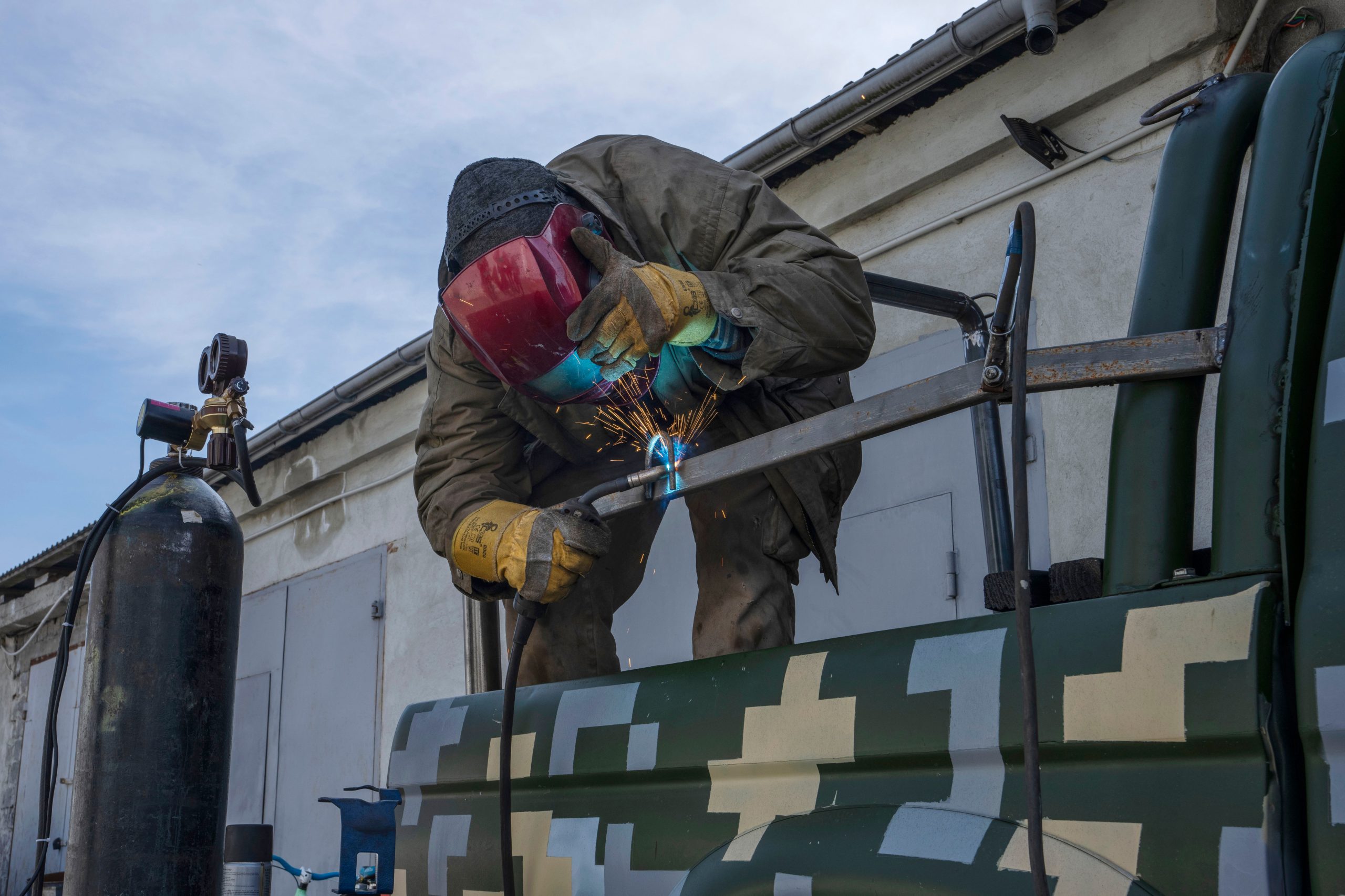 Our victory depends on us: Ukrainian welders turn donated vehicles into army transport