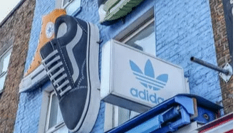Adidas trips into quarterly loss, expects to bounce back to profitability