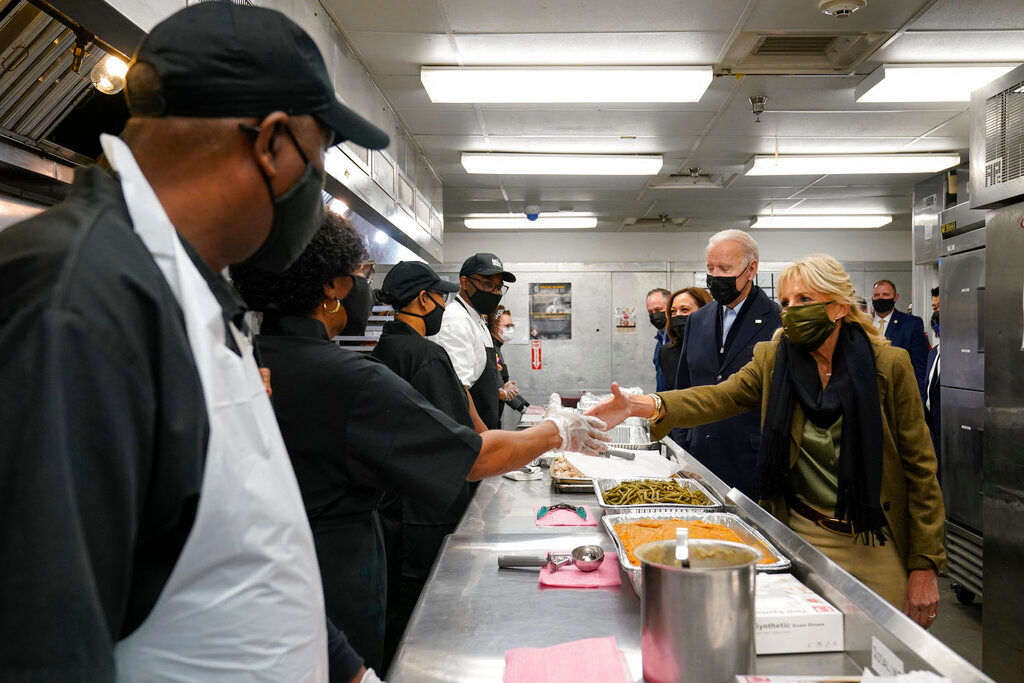 President, VP and spouses volunteer to help in food kitchen for thanksgiving