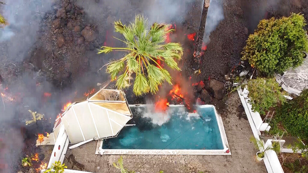 Watch: Lava from Spain’s Cumbre Vieja volcano fills up swimming pool