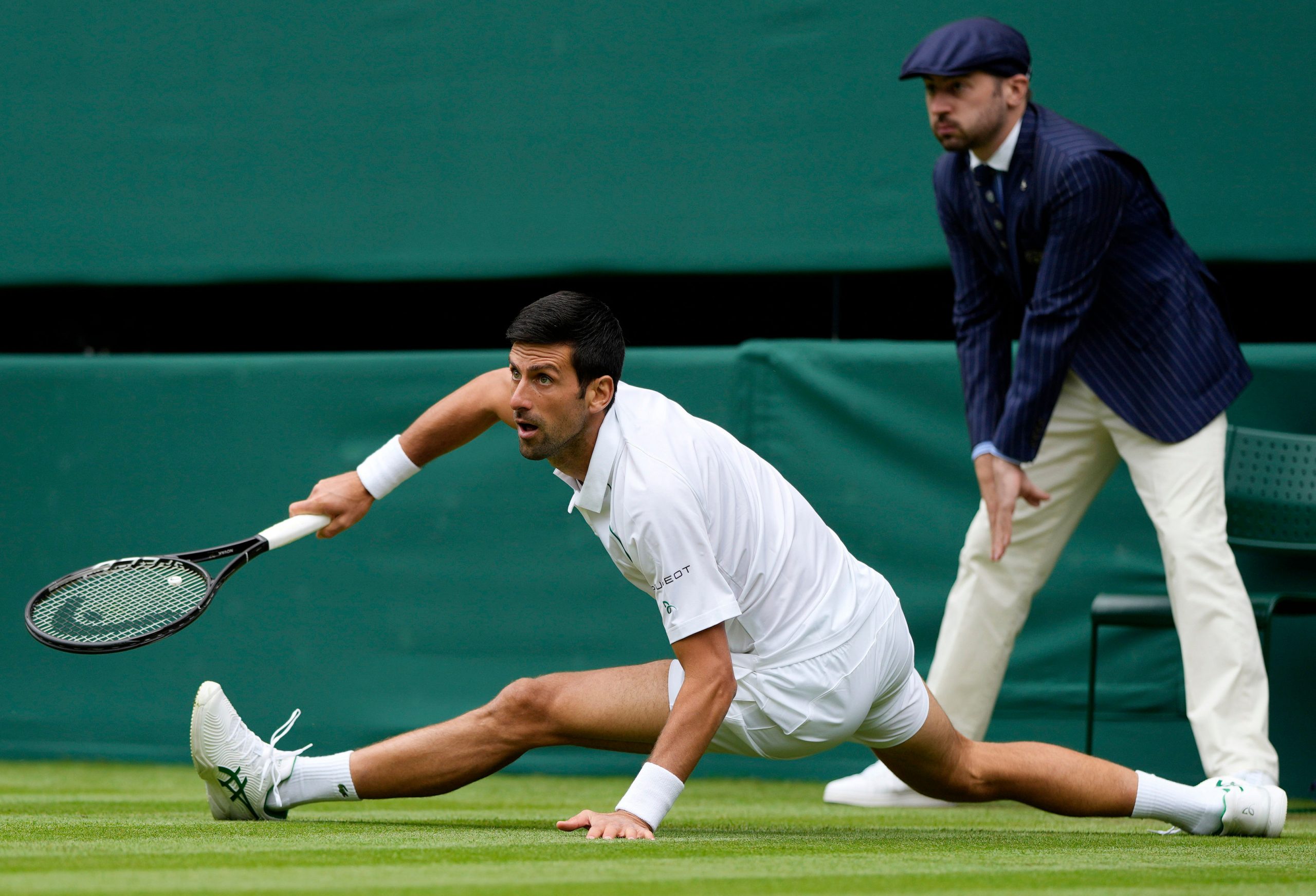 Novak Djokovic into Wimbledon last 32 after surviving a series of falls