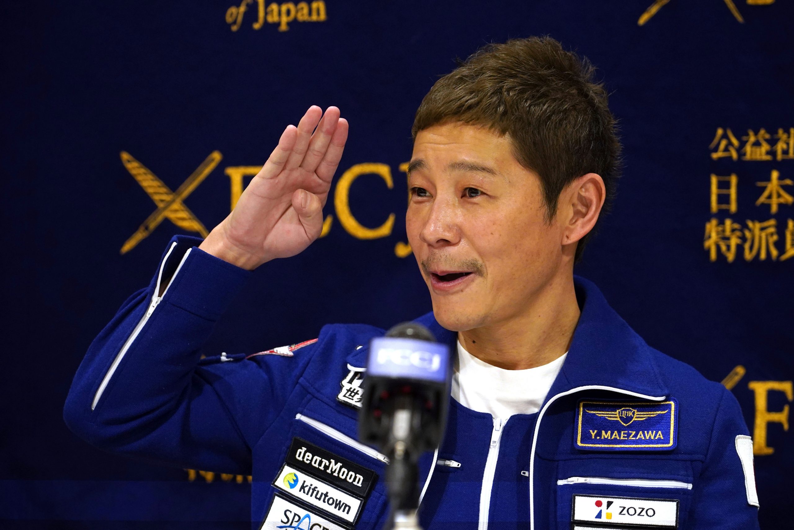 Japan tycoon Yusaku Maezawa returns from space with business dreams