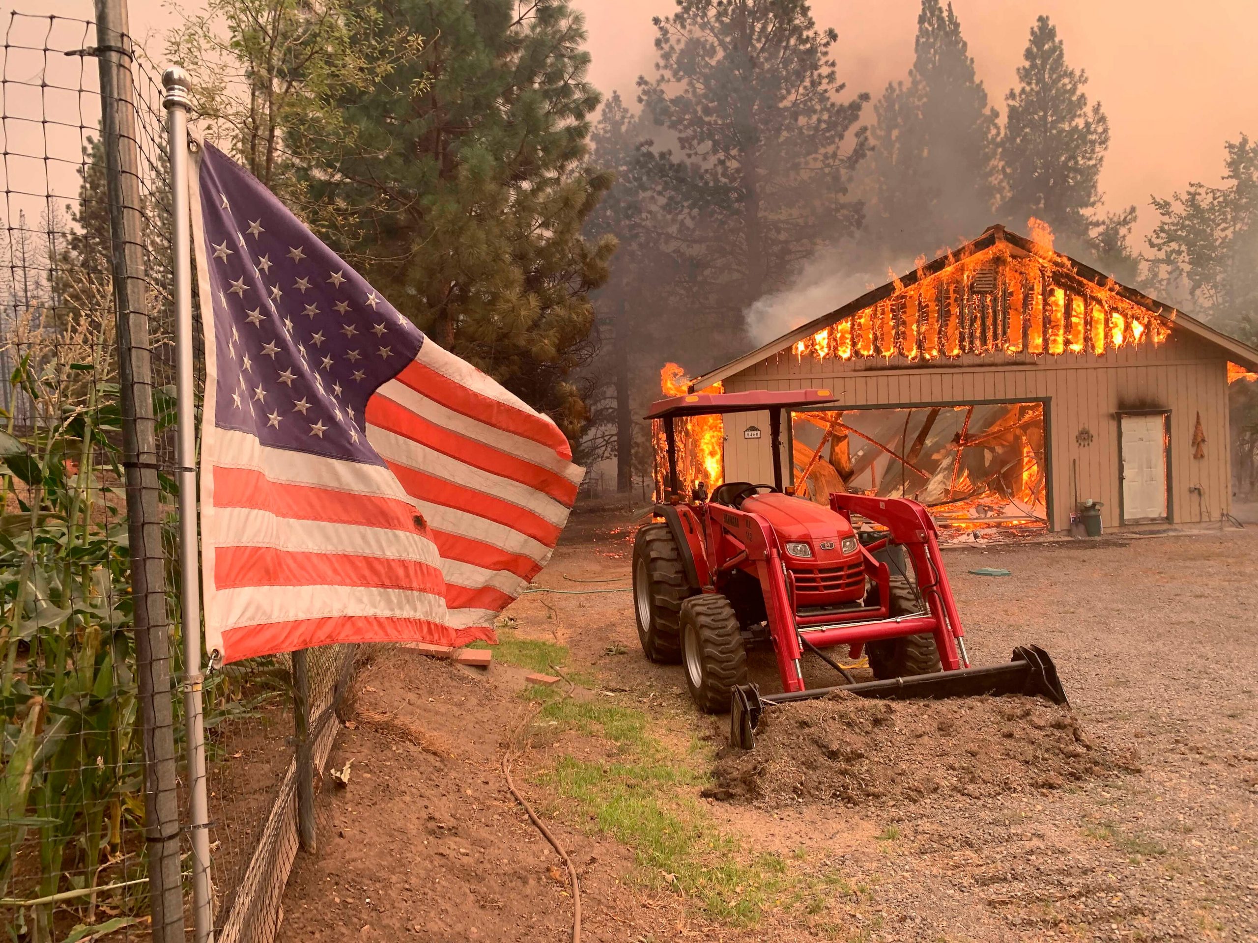 Crews battle largest US wildfire, threats grow across West