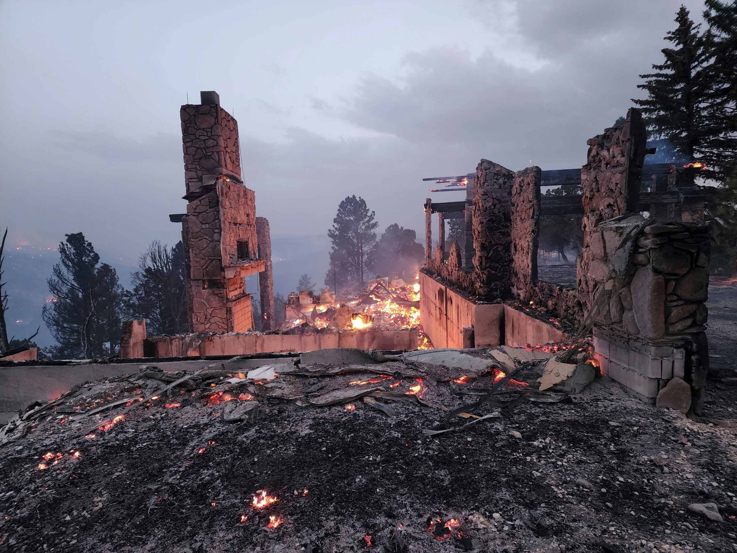 Destructive wildfires rage in New Mexico, Colorado