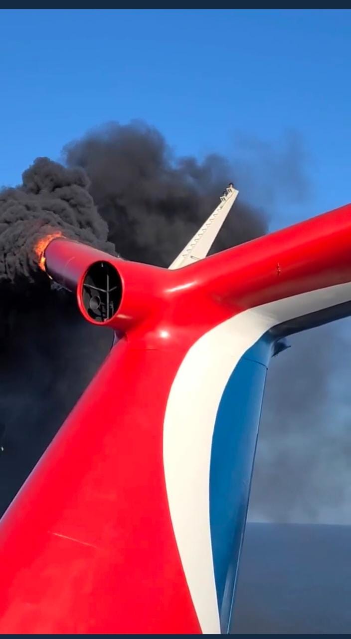 Carnival cruise ship catches fire while docked in Grand Turk. Video