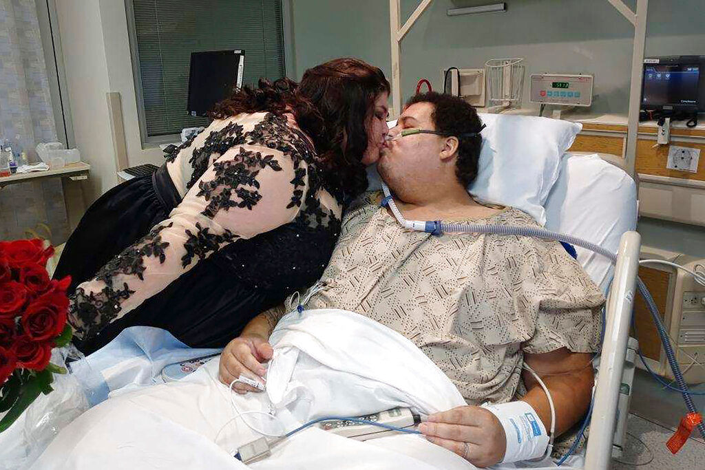 Love in the time of COVID: Iowa man weds in hospital after battle with virus