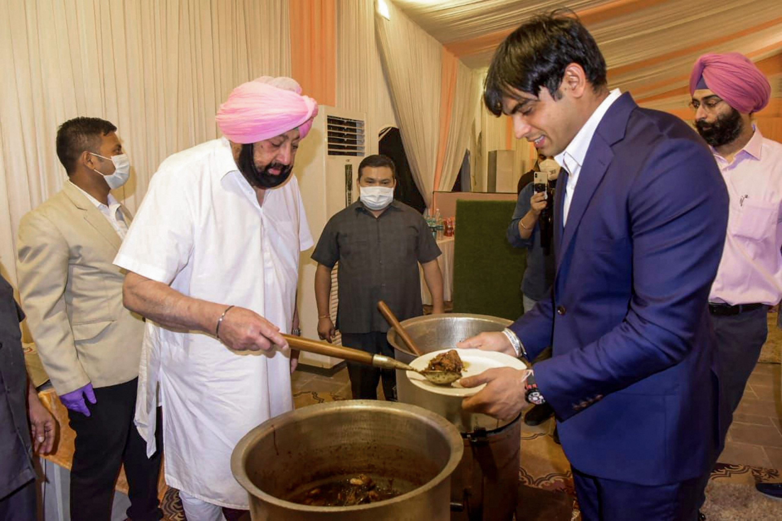 Watch: Punjab CM dons chef’s hat, cooks, serves food to Olympians