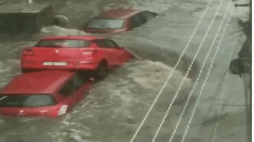 Watch | Floodwater washes away car in Hyderabad
