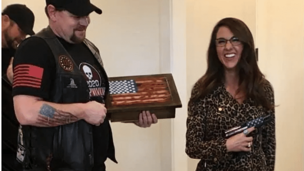 Republican Lauren Boebert draws criticism over flaunting guns in video call background