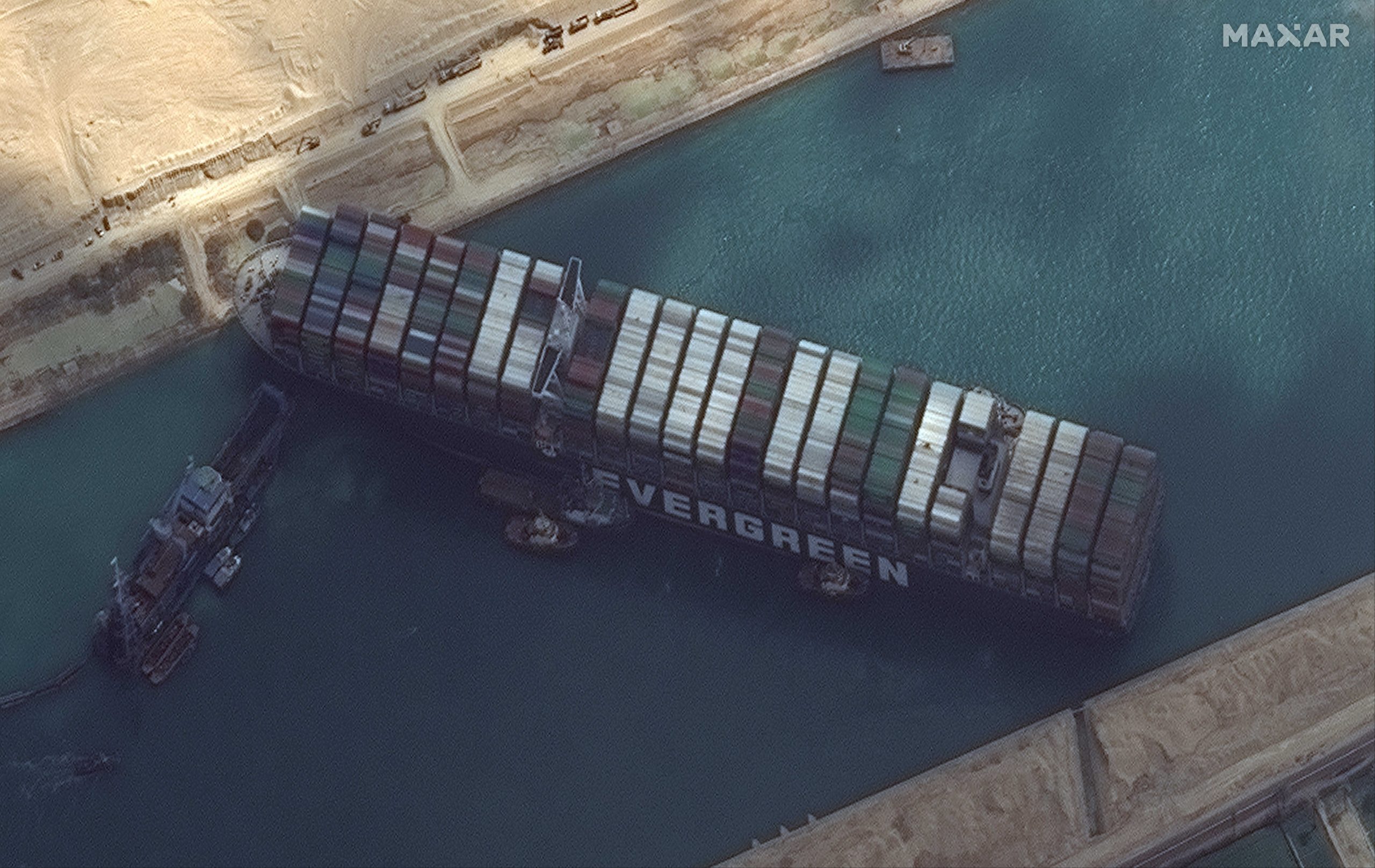 Ship, blocking Suez Canal, ‘has turned’ but not afloat, says owner