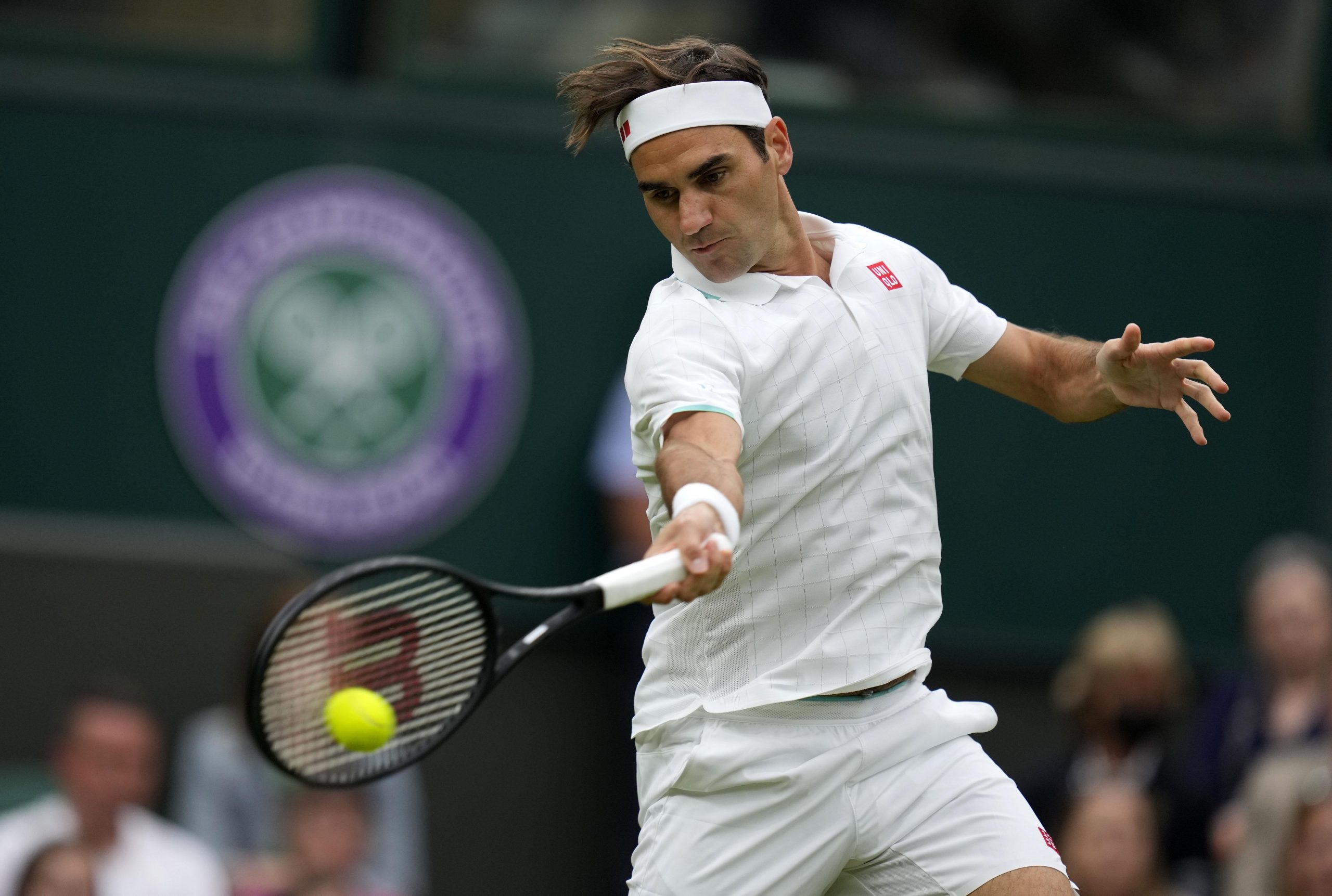 Wimbledon: Roger Federer survives centre court scare, advances to round 2