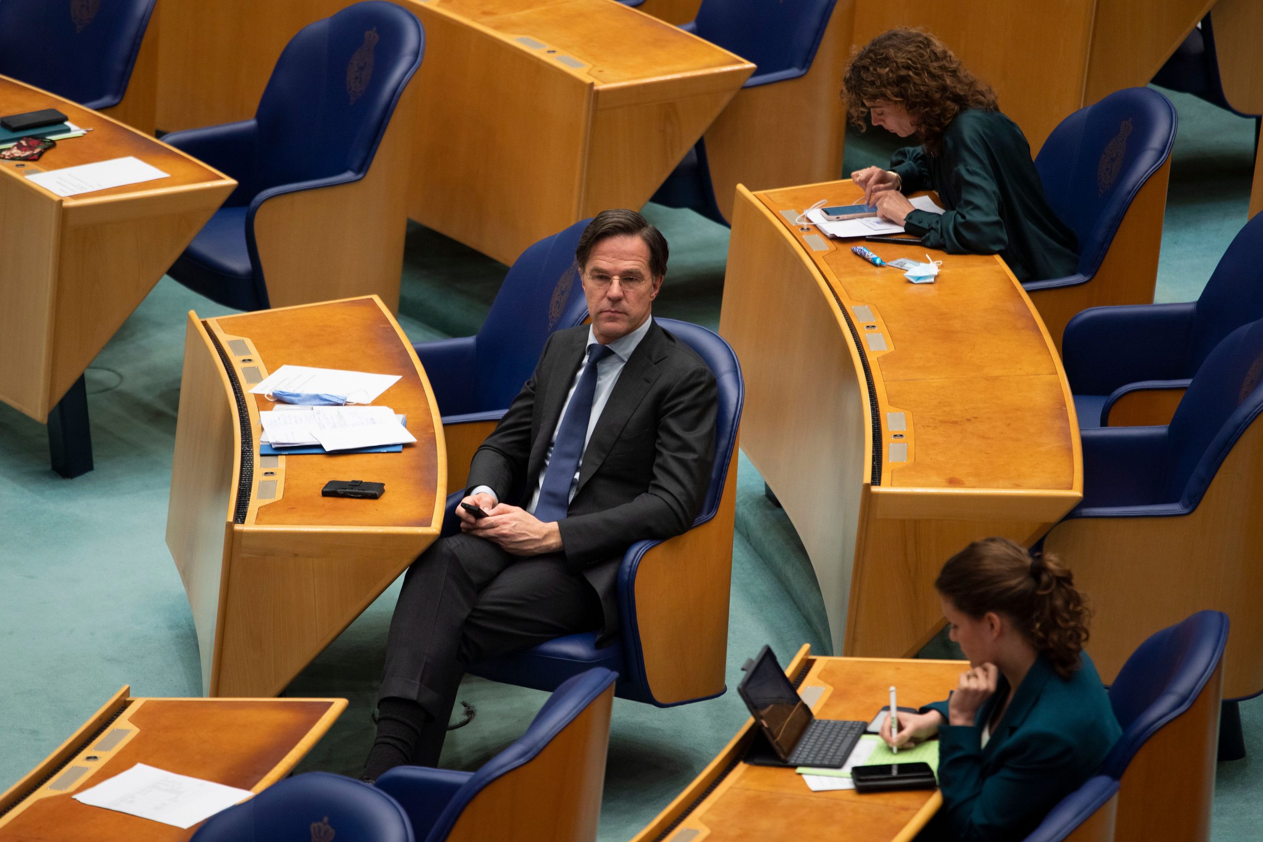 Dutch PM Mark Rutte clings on after political battle