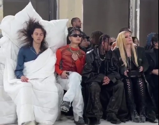 Who is Tommy Cash? Rapper dressed like bed sits next to Avril Lavigne and Tyga at Paris Fashion Week
