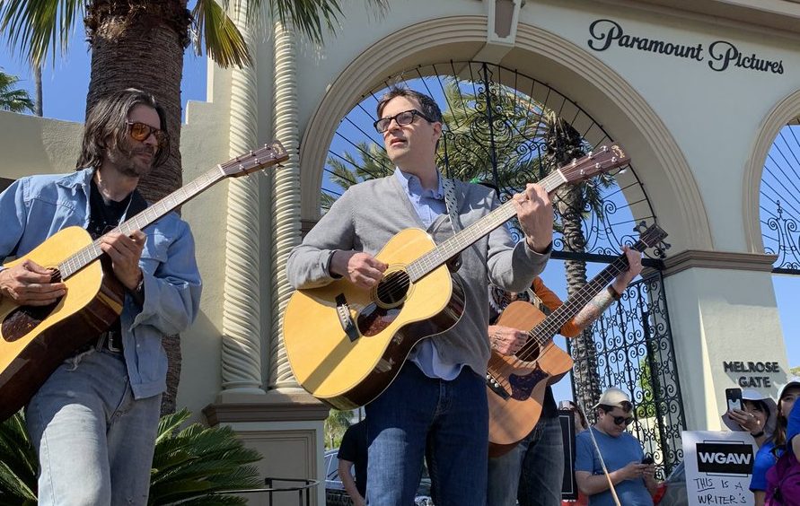 Weezers – Rivers Cuomo, Brian Bell and Scott Shriner – perform at writers’ strike outside Paramount studio: Watch video