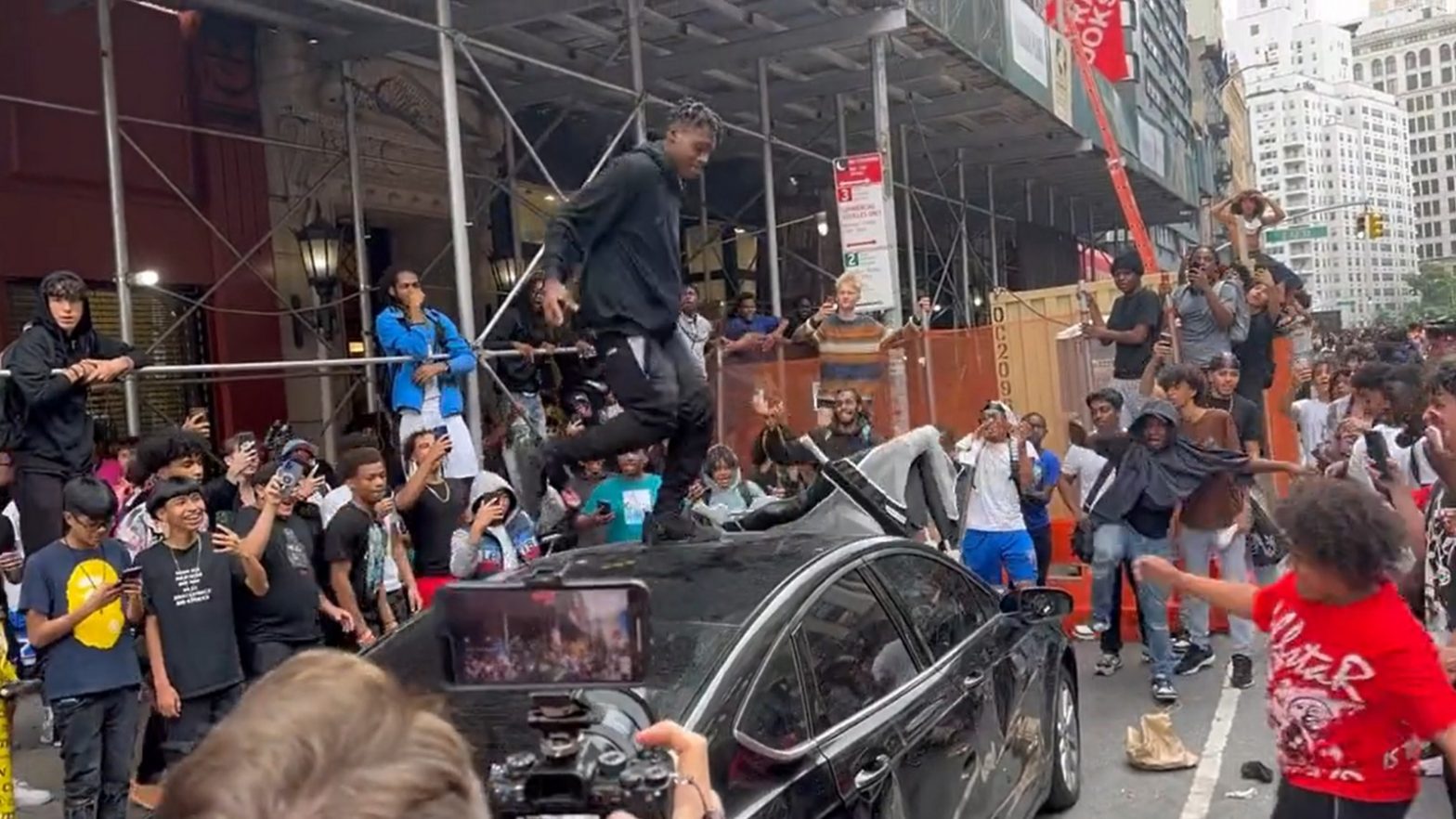 Kai Cenat’s fan dances on car’s roof while others kick, punch vehicle at New York giveaway | Watch Video
