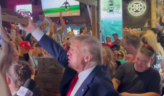 Trump hands out pizzas at Iowa pub, saying ‘Here, darling’ | Watch Video