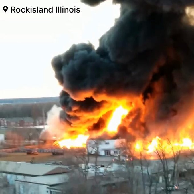 Numerous firefighters battle a massive blaze at cattle barn in Rock Island, Illinois